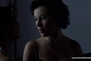 A real man is repairing a car and has his mistress in the girls ' bedroom